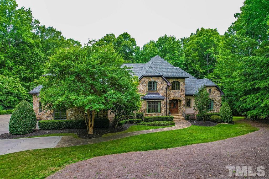 11213 Jonas Ridge Lane Raleigh, NC 27613 - Photo 4 of 100 a front view of a house with a yard