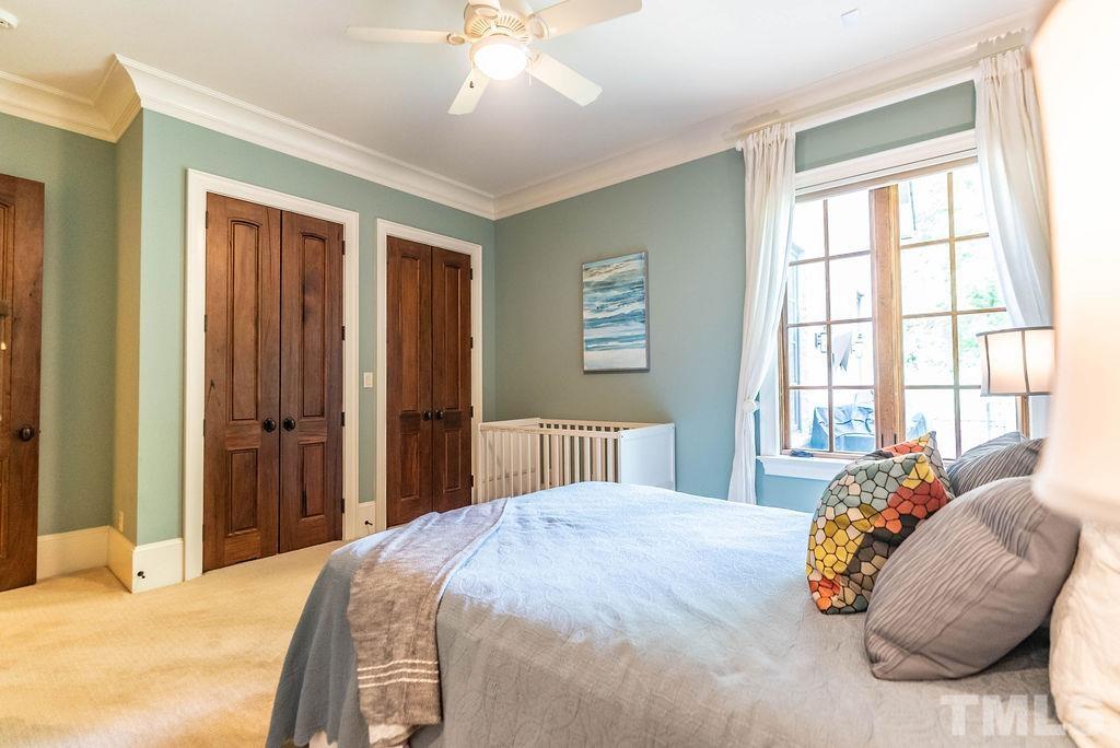 11213 Jonas Ridge Lane Raleigh, NC 27613 - Photo 43 of 100 a bedroom with a bed and wooden floor