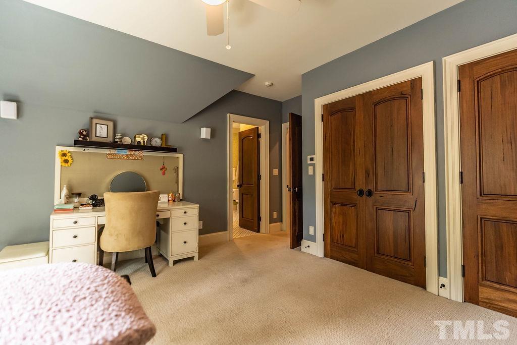 11213 Jonas Ridge Lane Raleigh, NC 27613 - Photo 57 of 100 a living room with furniture and a wooden floor