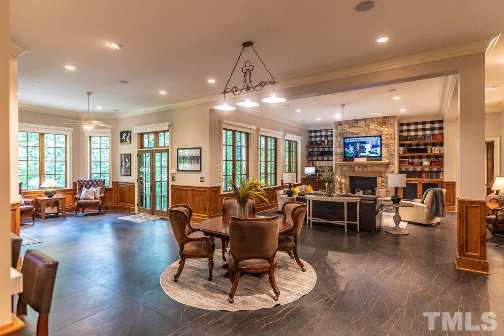 11213 Jonas Ridge Lane Raleigh, NC 27613 - Photo 69 of 100 a view of a dining room with furniture window and wooden floor