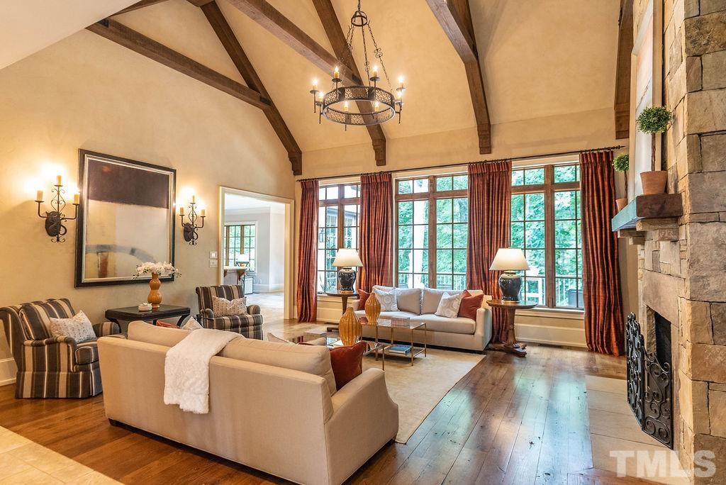 11213 Jonas Ridge Lane Raleigh, NC 27613 - Photo 7 of 100 a living room with fireplace furniture and a large window