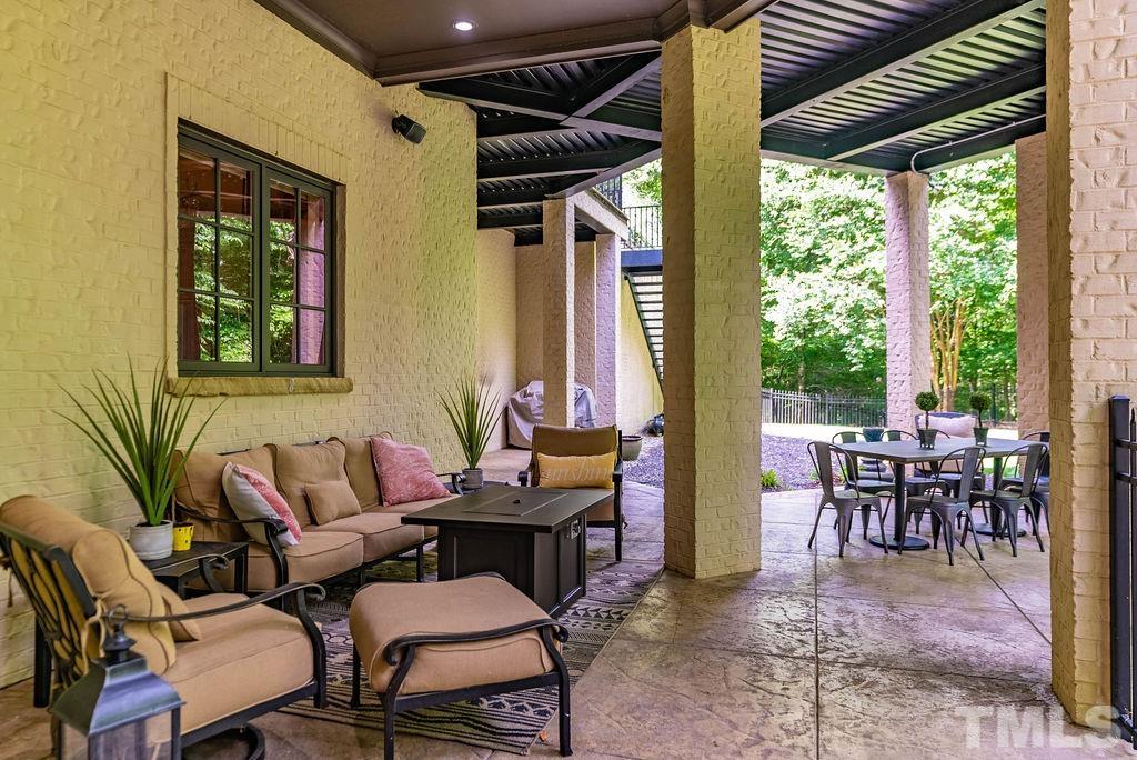 11213 Jonas Ridge Lane Raleigh, NC 27613 - Photo 83 of 100 a outdoor space with lots of furniture and windows