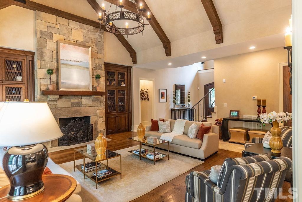 11213 Jonas Ridge Lane Raleigh, NC 27613 - Photo 9 of 100 a living room with furniture kitchen view and a fireplace