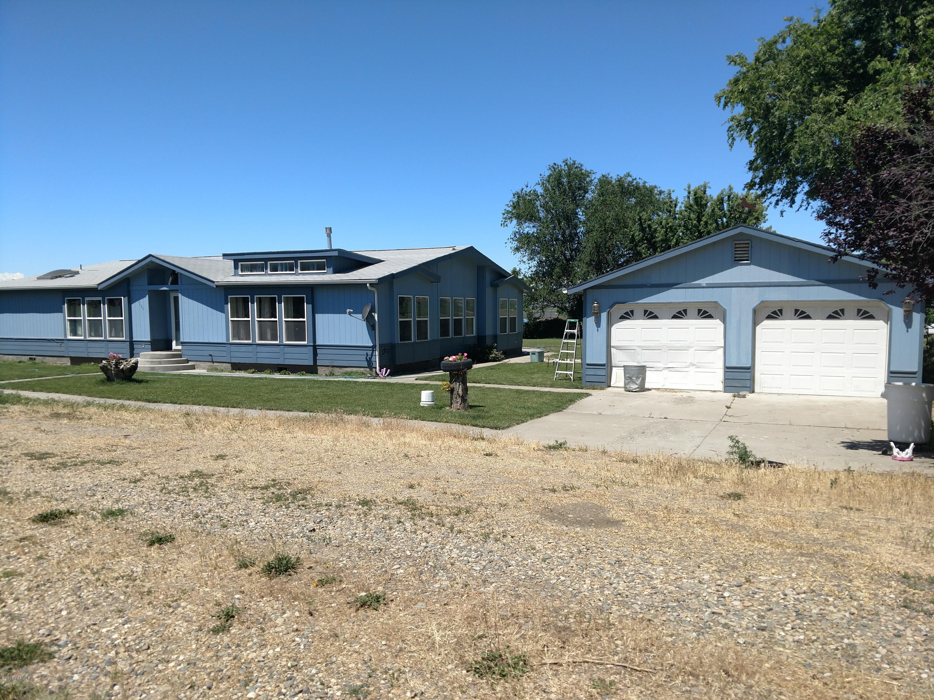 1101 Gap Road Granger, WA 98932 - Photo 1 of 24 a front view of a house with a yard