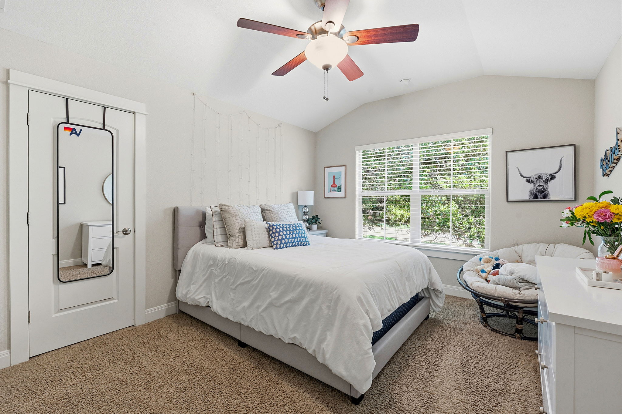 15317 Falconhead Grove Loop Austin, TX 78738 - Photo 20 of 36 Vaulted ceiling bedroom featuring plush carpeting and a ceiling fan with light fixture