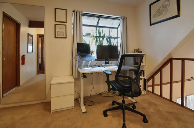 a kitchen that has a lot of cabinets in it