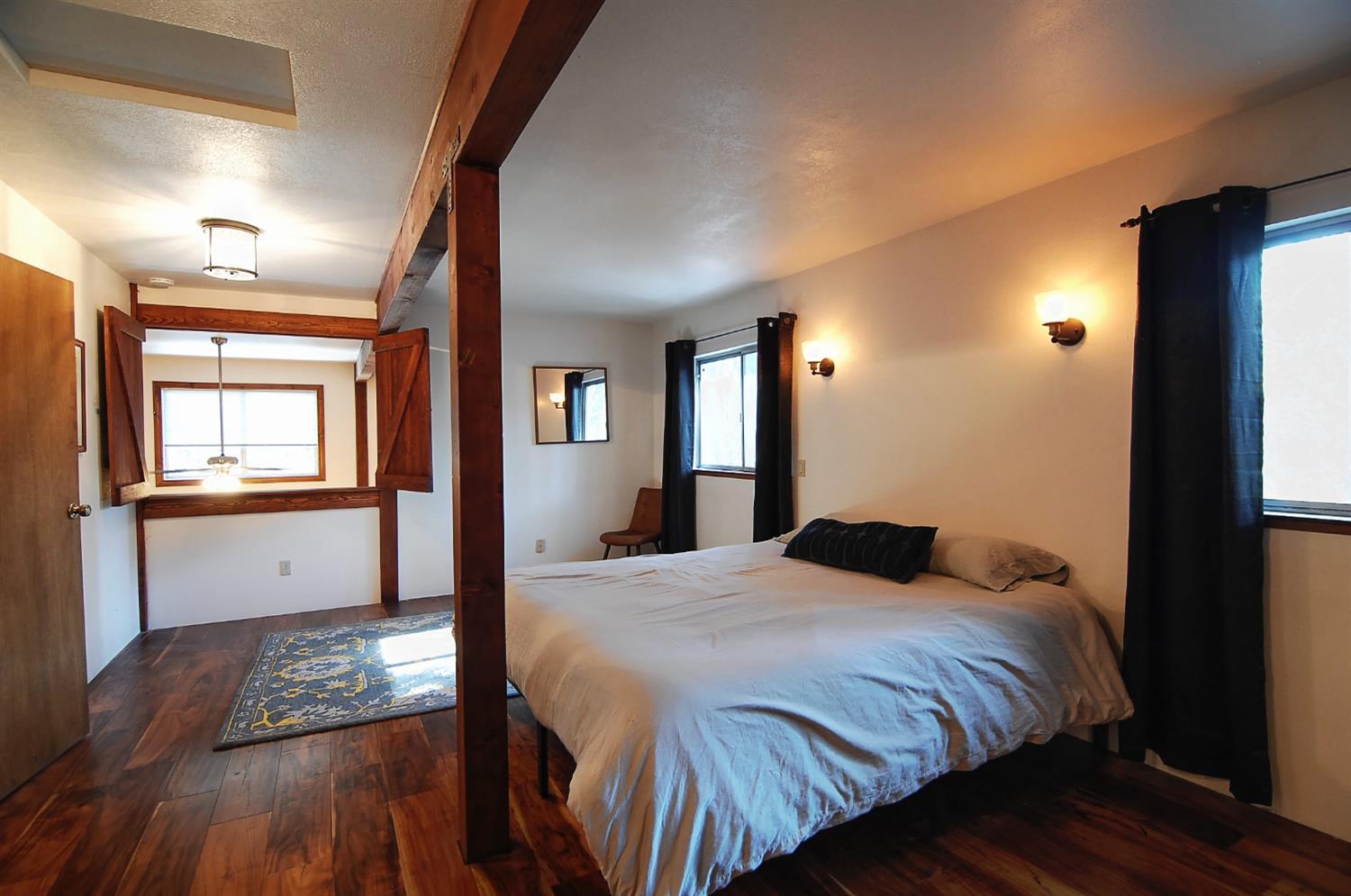 16914 Pasquale Road Nevada City, CA 95959 - Photo 21 of 32 a bedroom with a bed and a window