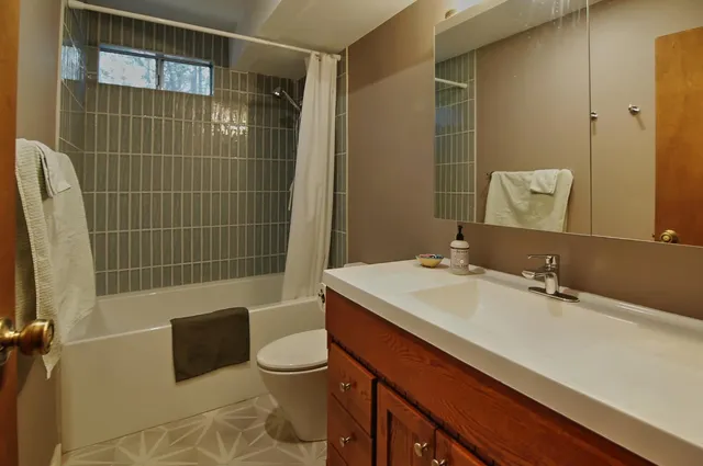 a bed sitting in a balcony next to a yard