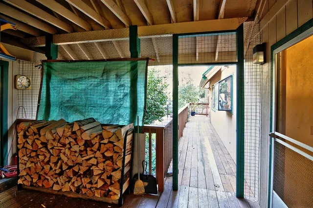 a room with wooden floor and furniture
