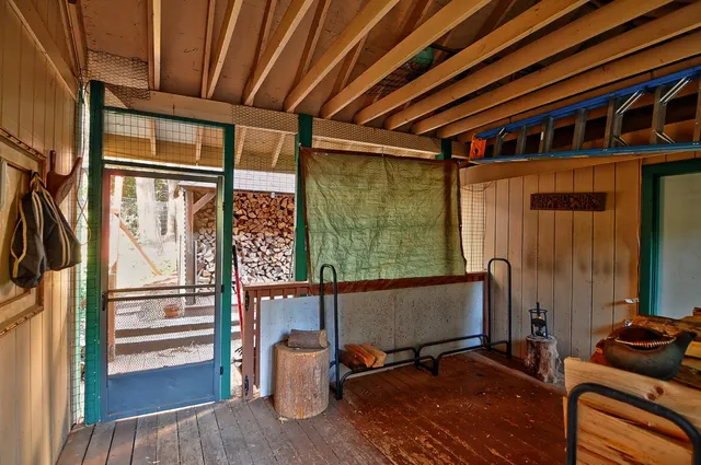 a view of balcony with furniture and wooden floor