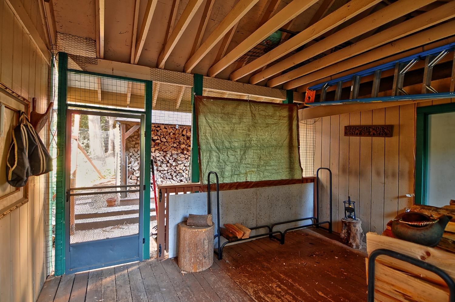 16914 Pasquale Road Nevada City, CA 95959 - Photo 27 of 32 a room with wooden floor and furniture