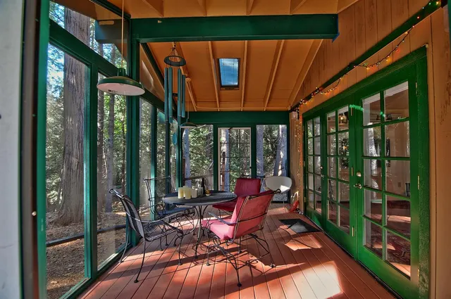 a view of a patio with a table chairs and balcony