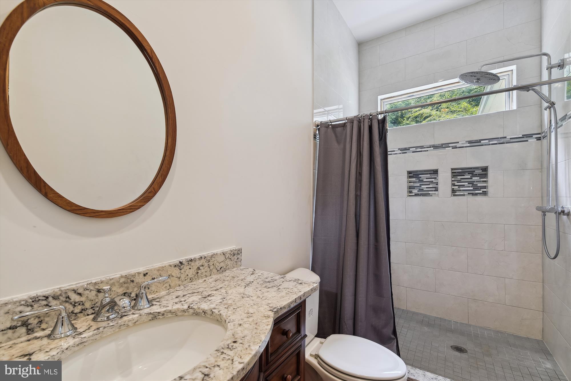 357 Forest Beach Road Annapolis, MD 21409 - Photo 15 of 91 a bathroom with a sink toilet and shower