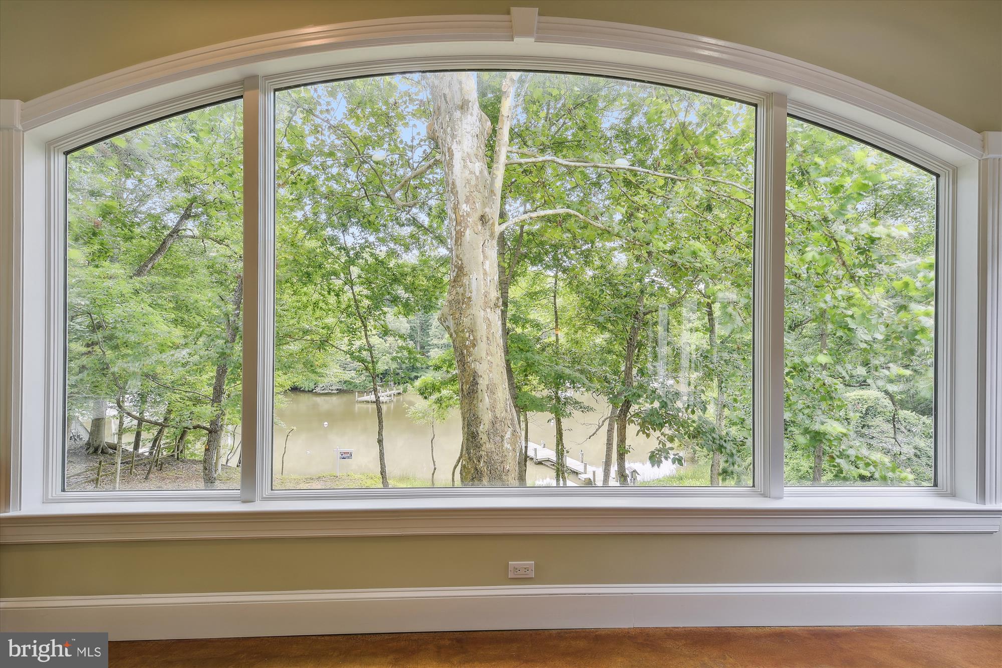 357 Forest Beach Road Annapolis, MD 21409 - Photo 26 of 91 a view of a room that has a bed and large windows