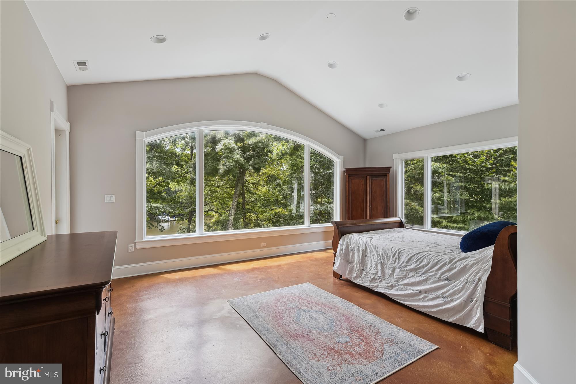 357 Forest Beach Road Annapolis, MD 21409 - Photo 35 of 91 a bed sitting in a bedroom next to a window