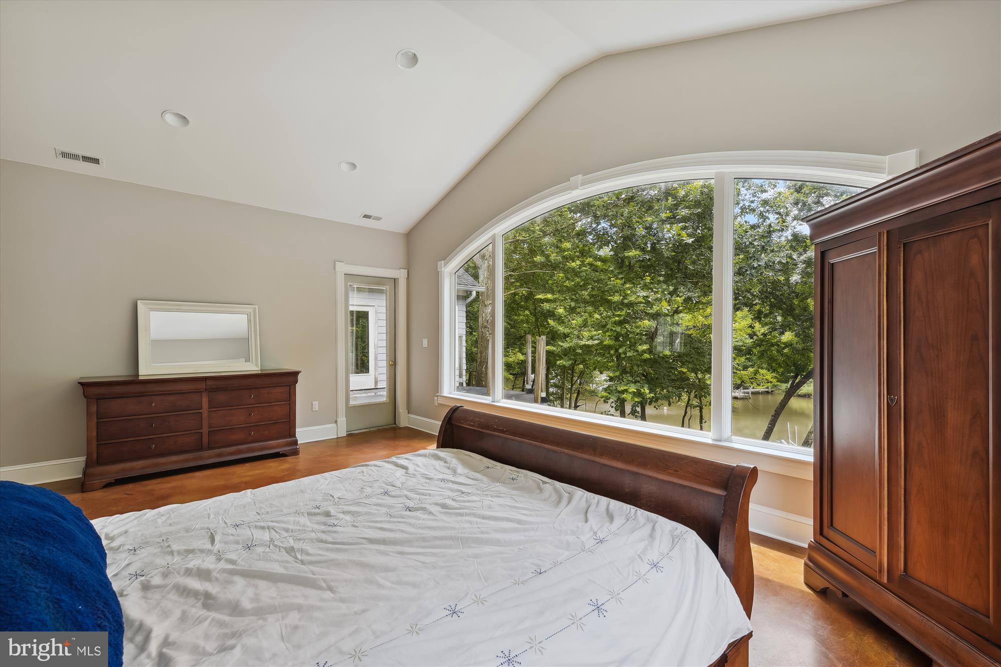357 Forest Beach Road Annapolis, MD 21409 - Photo 37 of 91 a bedroom with a bed and wooden floor