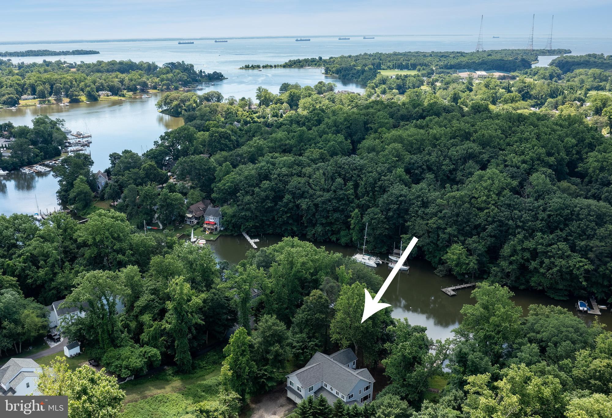 357 Forest Beach Road Annapolis, MD 21409 - Photo 40 of 91 an aerial view of green landscape with trees houses and lake view