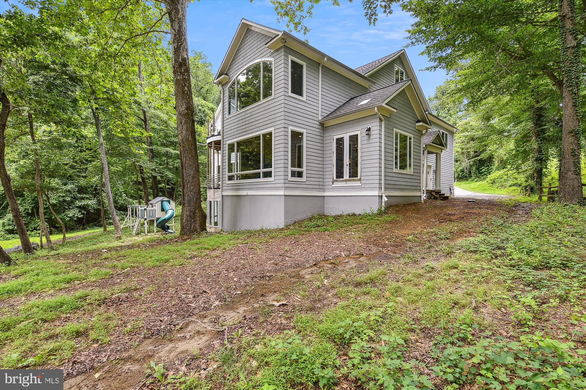 357 Forest Beach Road Annapolis, MD 21409 - Photo 52 of 91 a front view of a house with a yard and trees