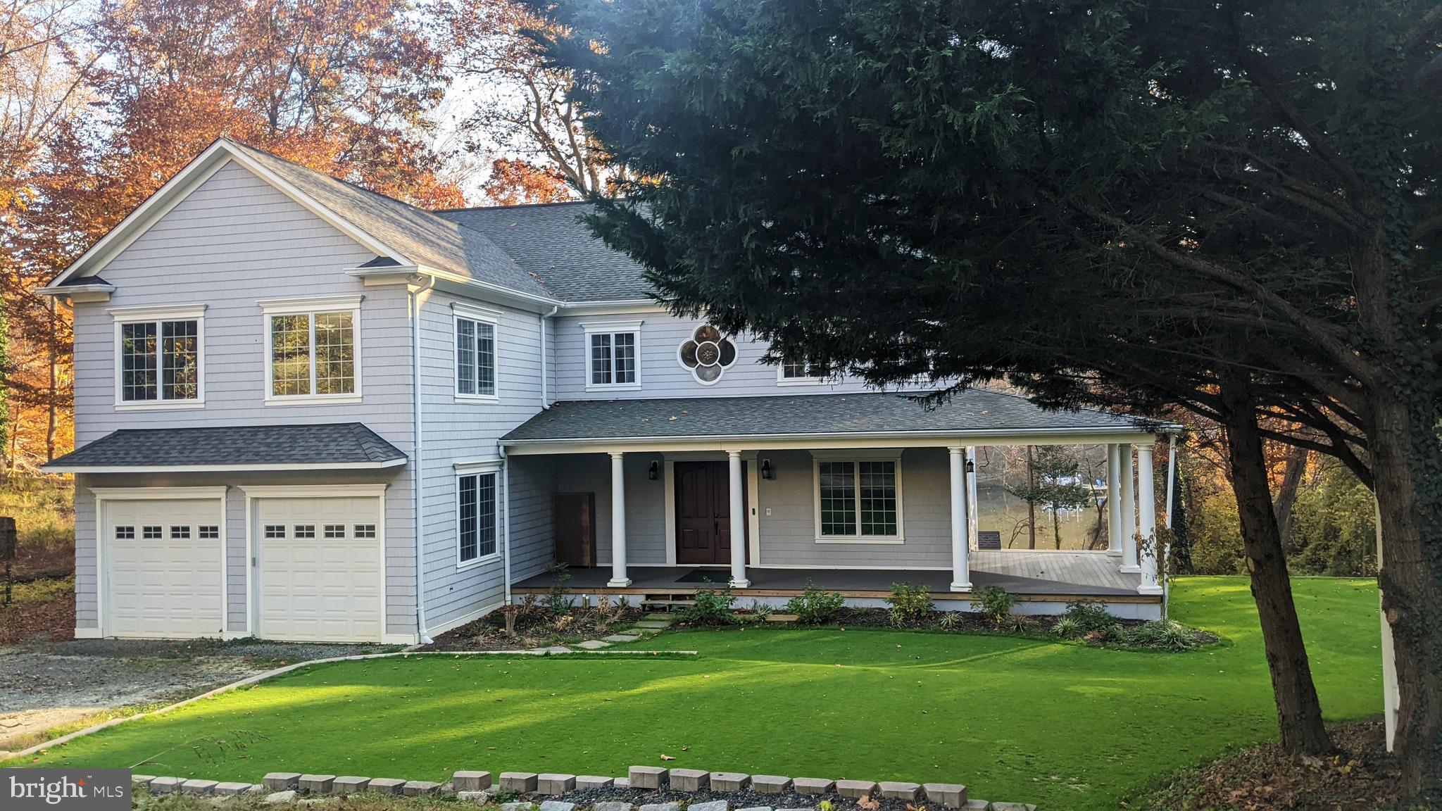 357 Forest Beach Road Annapolis, MD 21409 - Photo 89 of 91 a front view of a house with a garden and trees