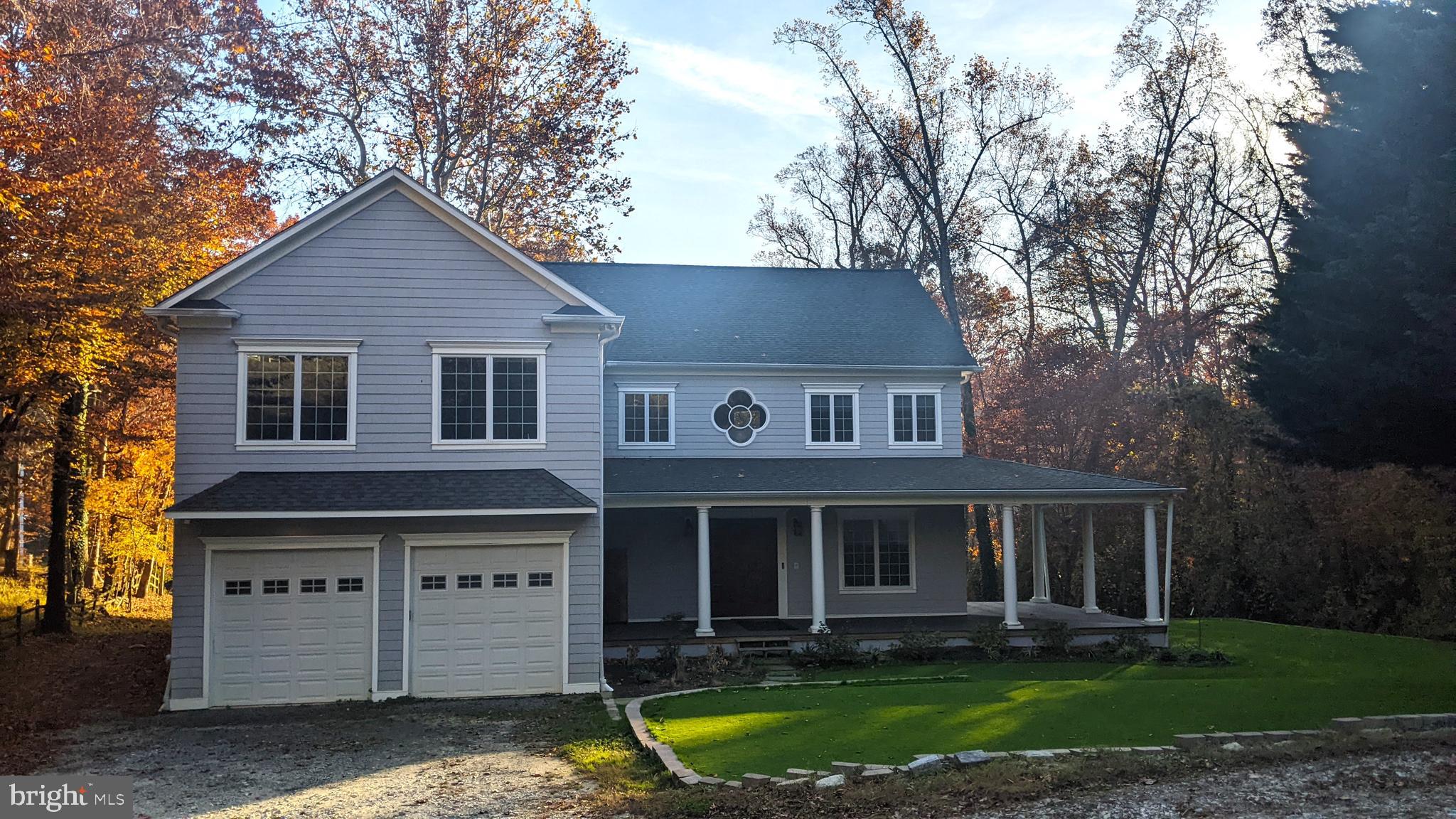 357 Forest Beach Road Annapolis, MD 21409 - Photo 90 of 91 a front view of a house with a garden and trees
