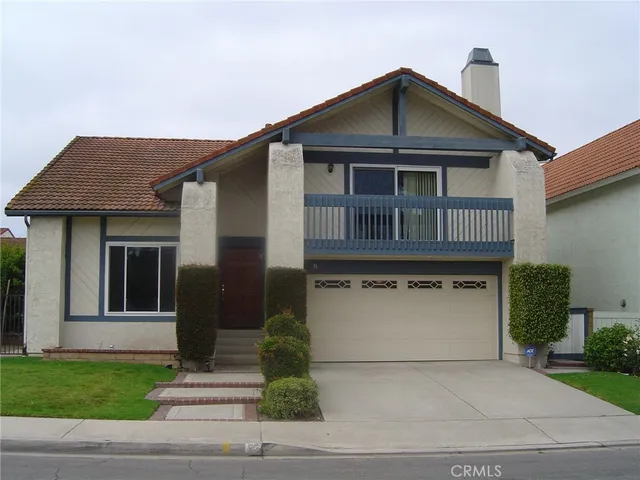 a front view of a house with a garage