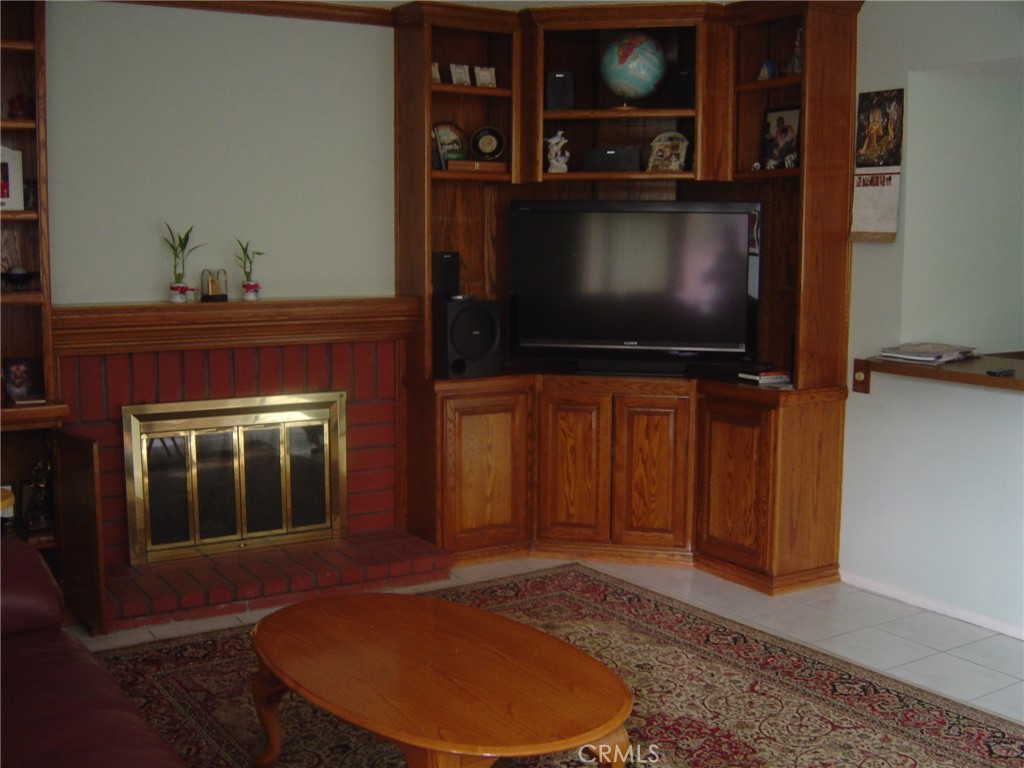 25 Mecklenberg Irvine, CA 92620 - Photo 5 of 12 a living room with furniture and a flat screen tv