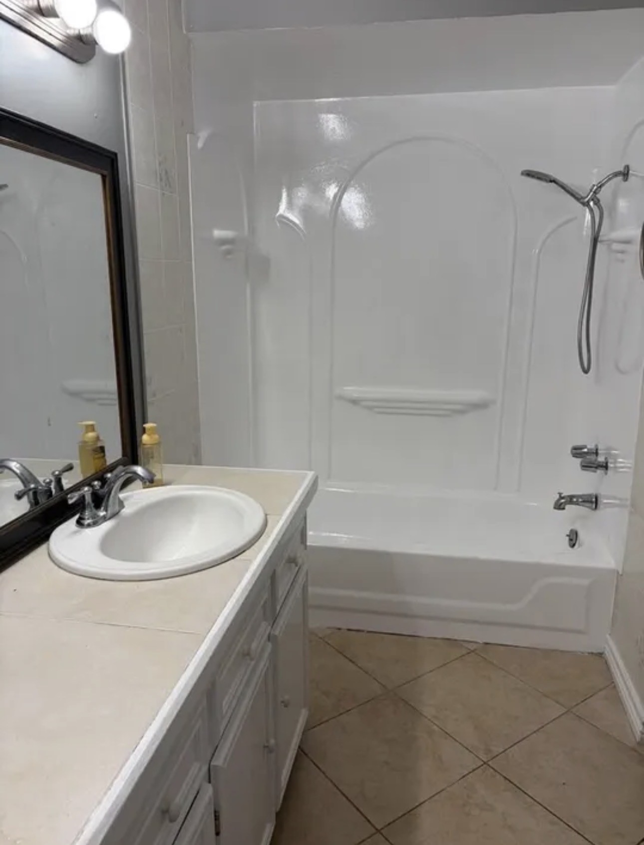 14529 Chapperal Pipeline Road, Unit A Conroe, TX 77302 - Photo 20 of 25 a bathroom with a sink and a mirror