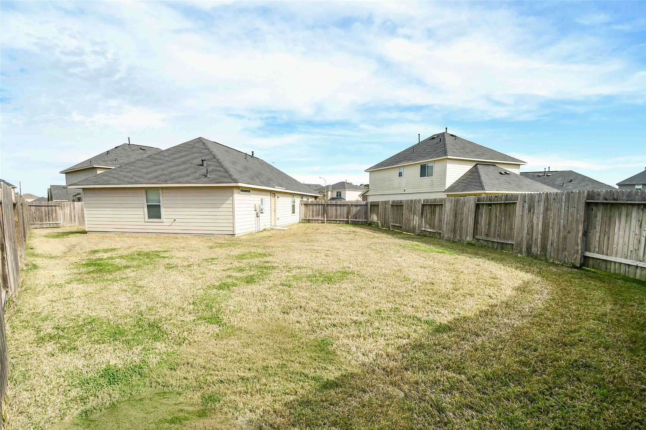 2407 Sailors Way Houston, TX 77073 - Photo 2 of 15 a front view of a house with a garden and yard