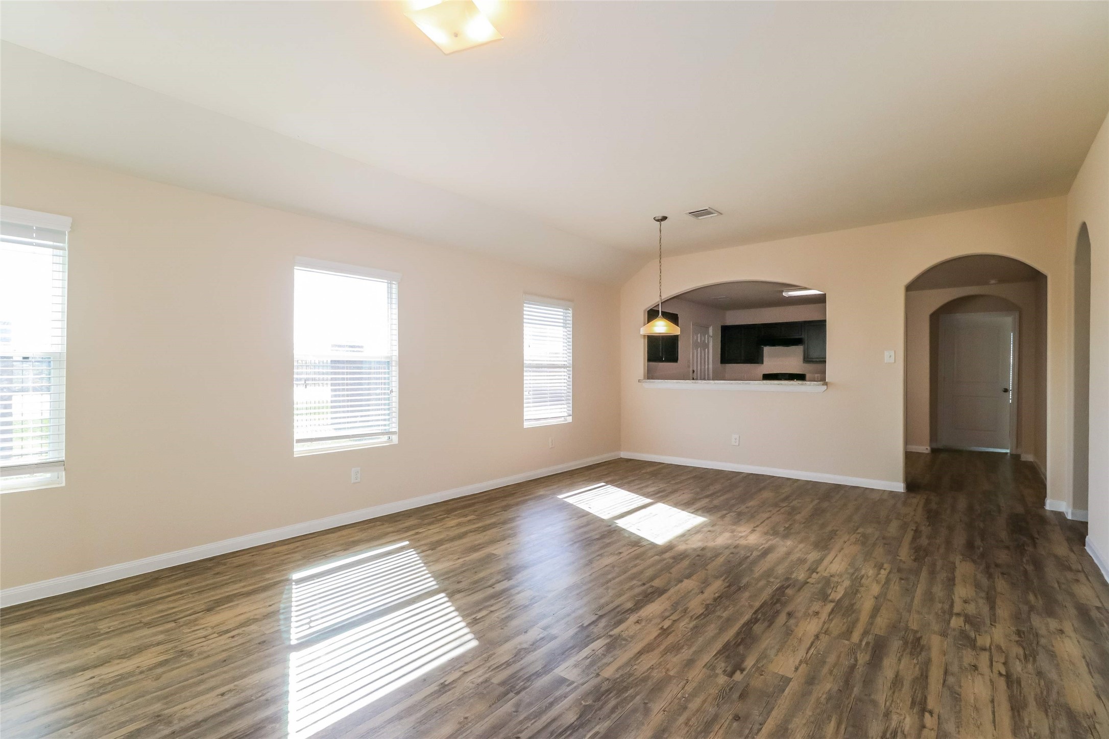 2407 Sailors Way Houston, TX 77073 - Photo 4 of 15 a view of an empty room with window and wooden floor