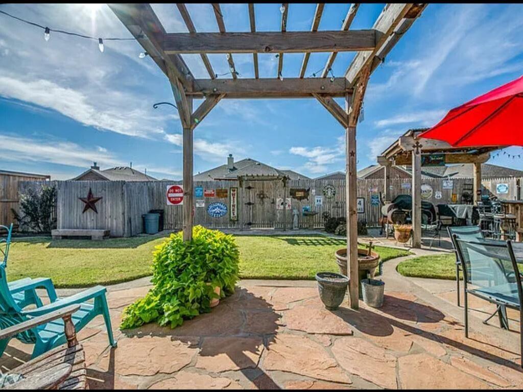 6115 100th Street Lubbock, TX 79424 - Photo 2 of 27 a view of yard with patio