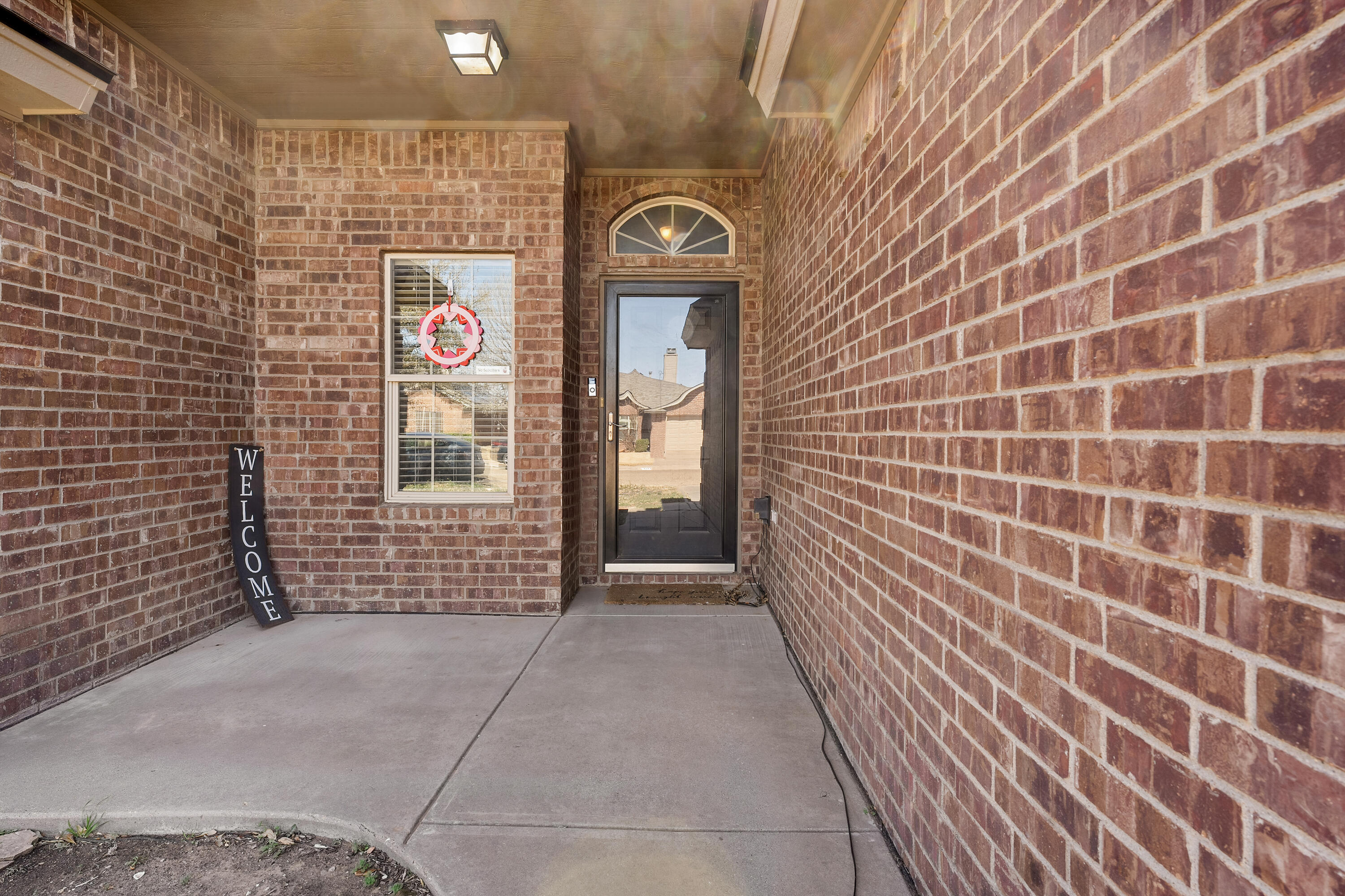 6115 100th Street Lubbock, TX 79424 - Photo 4 of 27 a view of a brick wall with an empty space
