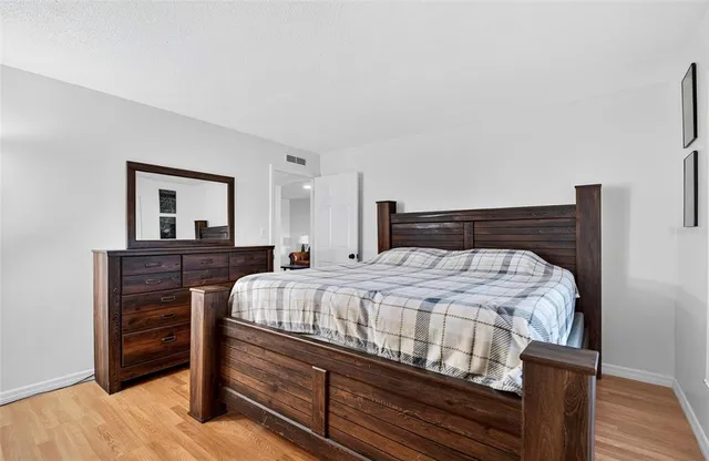 a bedroom with a bed and a dresser