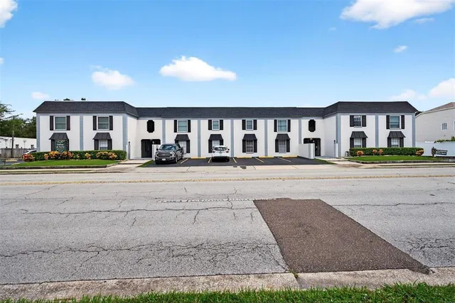 a front view of residential houses with yard