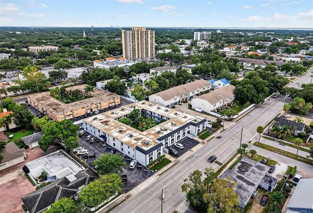 an aerial view of a house with a garden