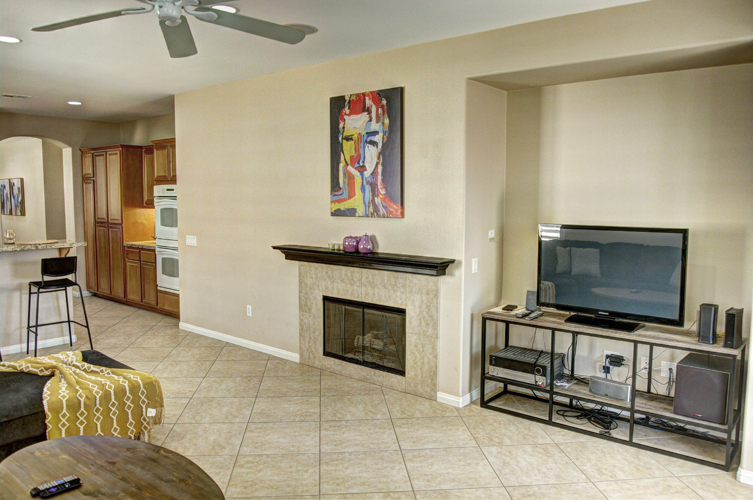 82053 Cochran Drive Indio, CA 92201 - Photo 14 of 38 a living room with furniture and a flat screen tv
