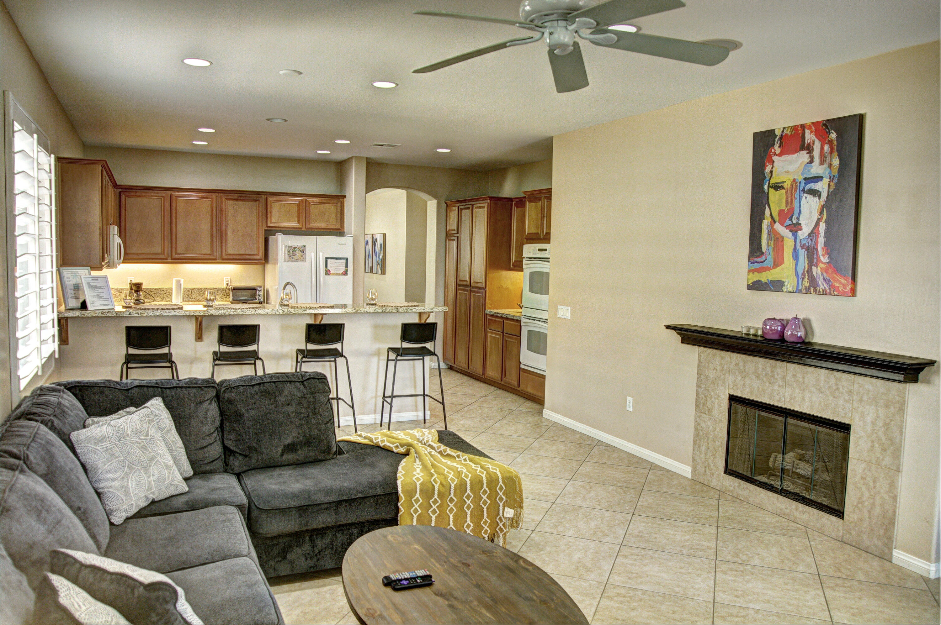 82053 Cochran Drive Indio, CA 92201 - Photo 17 of 38 a living room with furniture and a fireplace