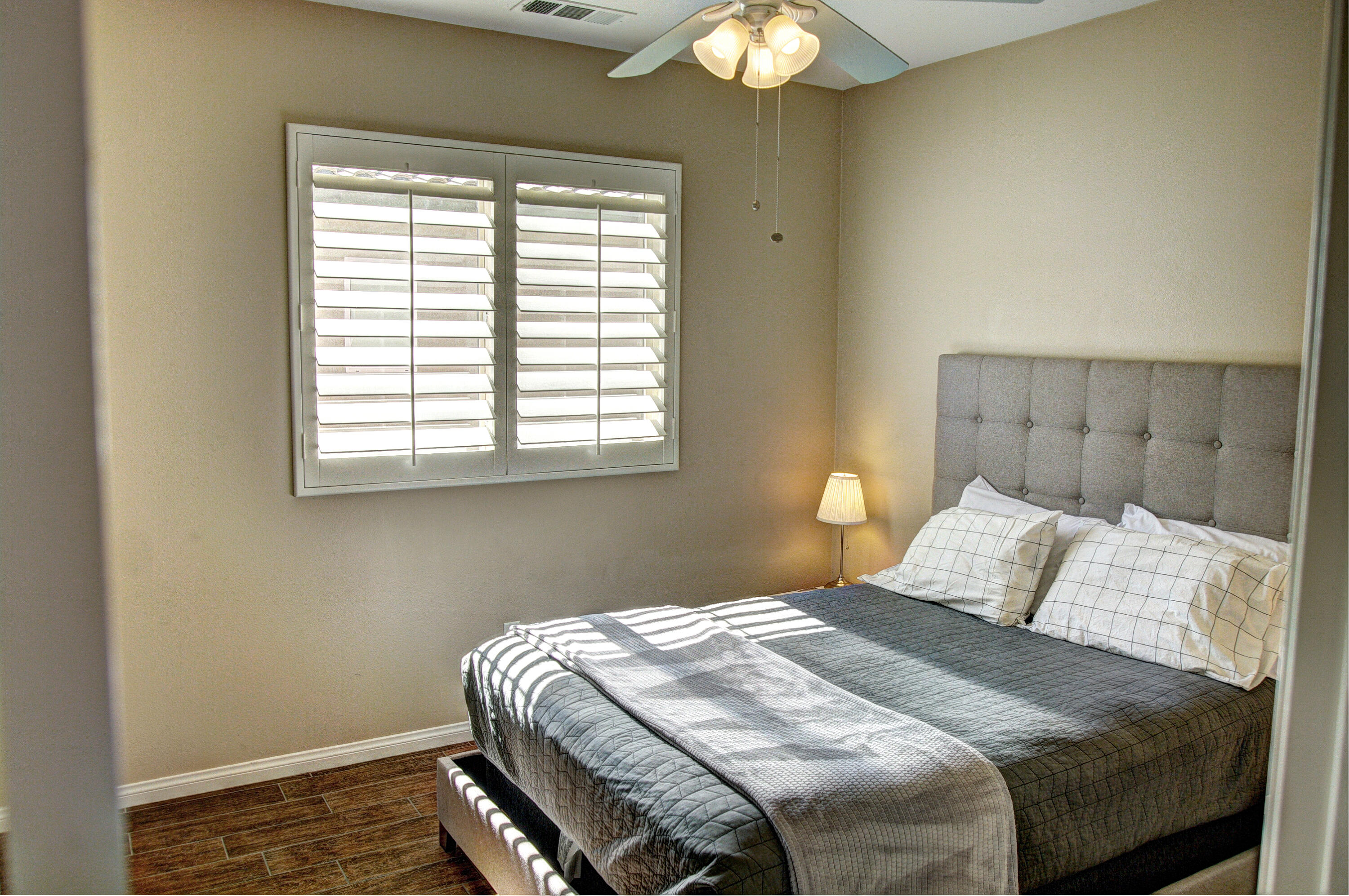 82053 Cochran Drive Indio, CA 92201 - Photo 20 of 38 a bedroom with a bed and a window