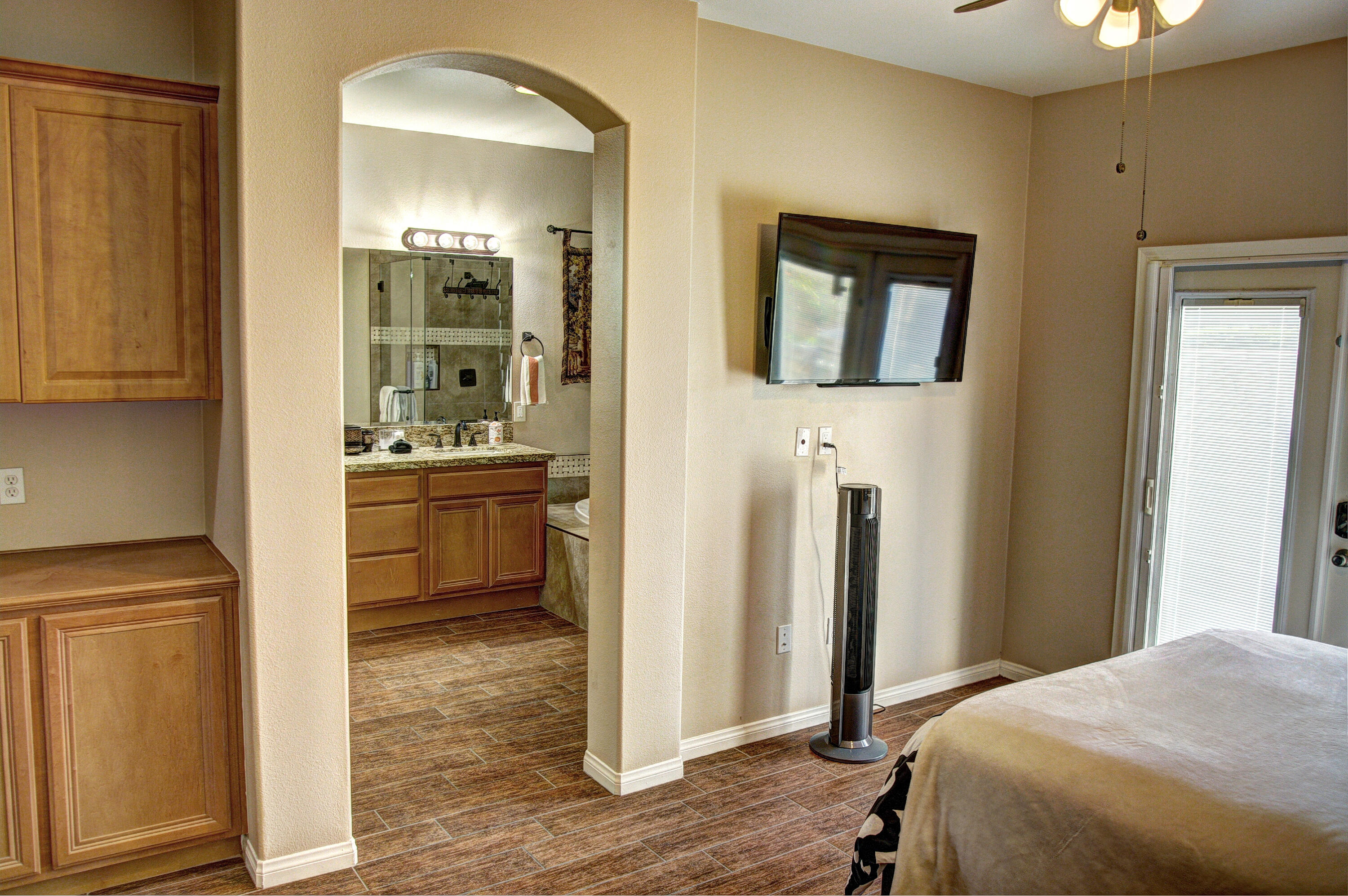 82053 Cochran Drive Indio, CA 92201 - Photo 24 of 38 a bedroom with a bed and a view of bathroom