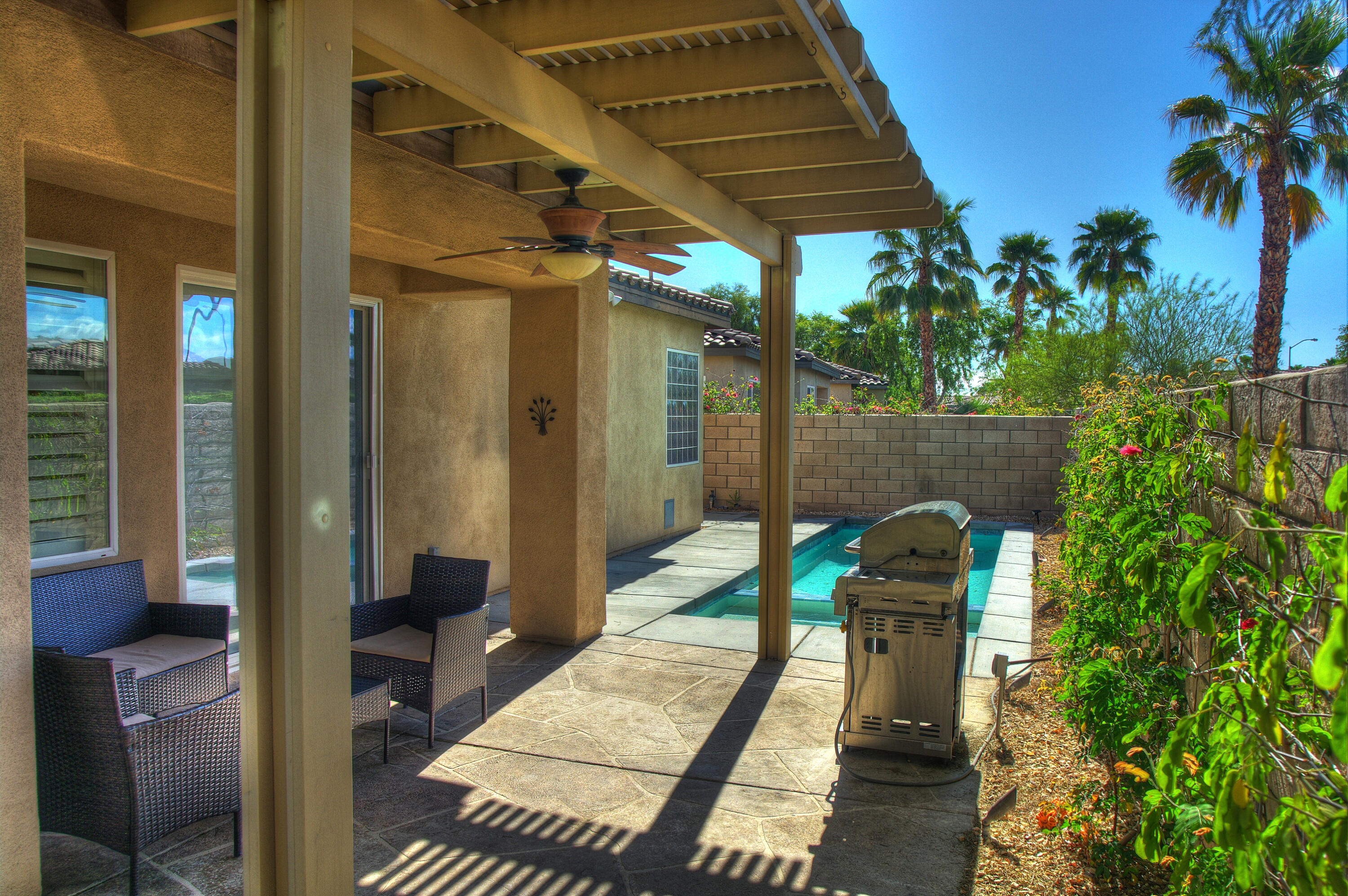 82053 Cochran Drive Indio, CA 92201 - Photo 28 of 38 a backyard of a house with seating space