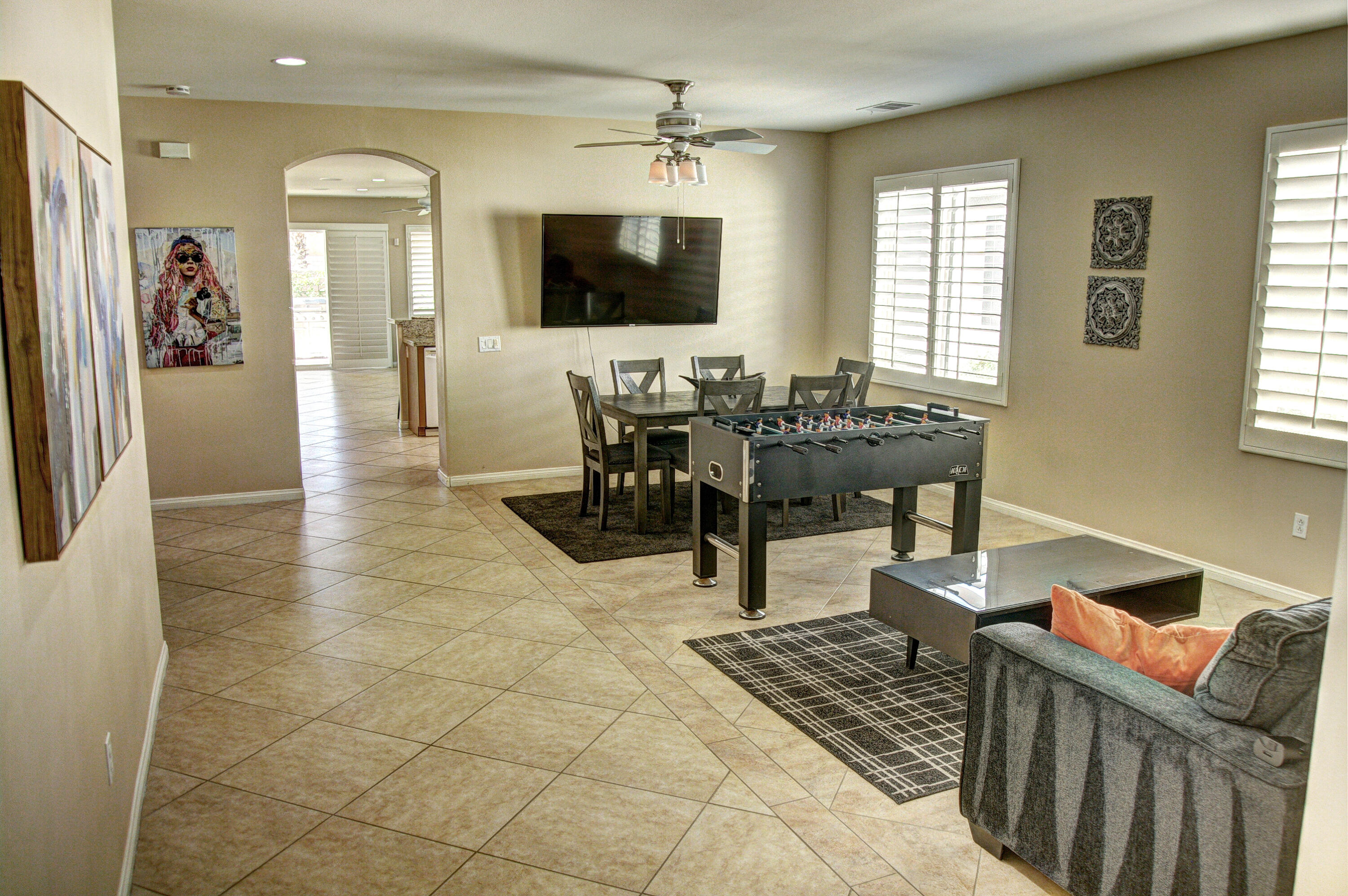 82053 Cochran Drive Indio, CA 92201 - Photo 3 of 38 a view of a livingroom with furniture and a flat screen tv