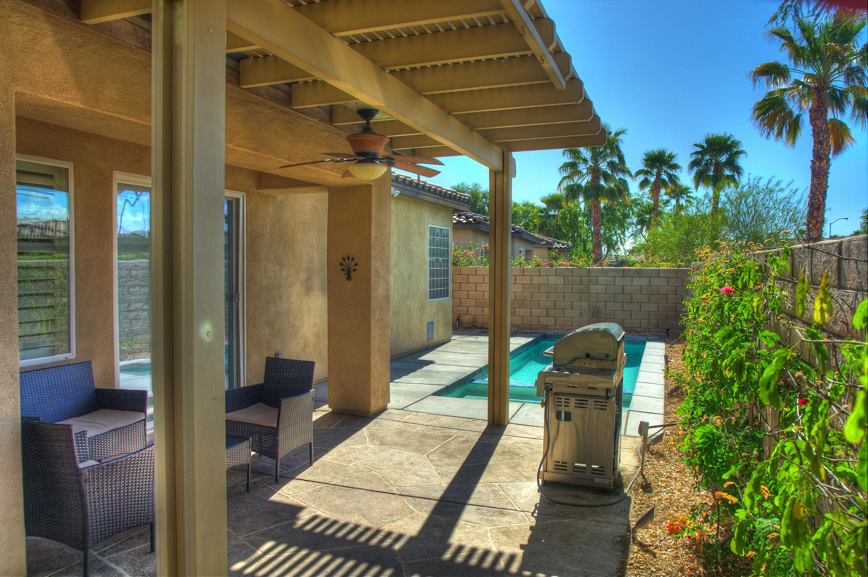 82053 Cochran Drive Indio, CA 92201 - Photo 31 of 38 a backyard of a house with seating space