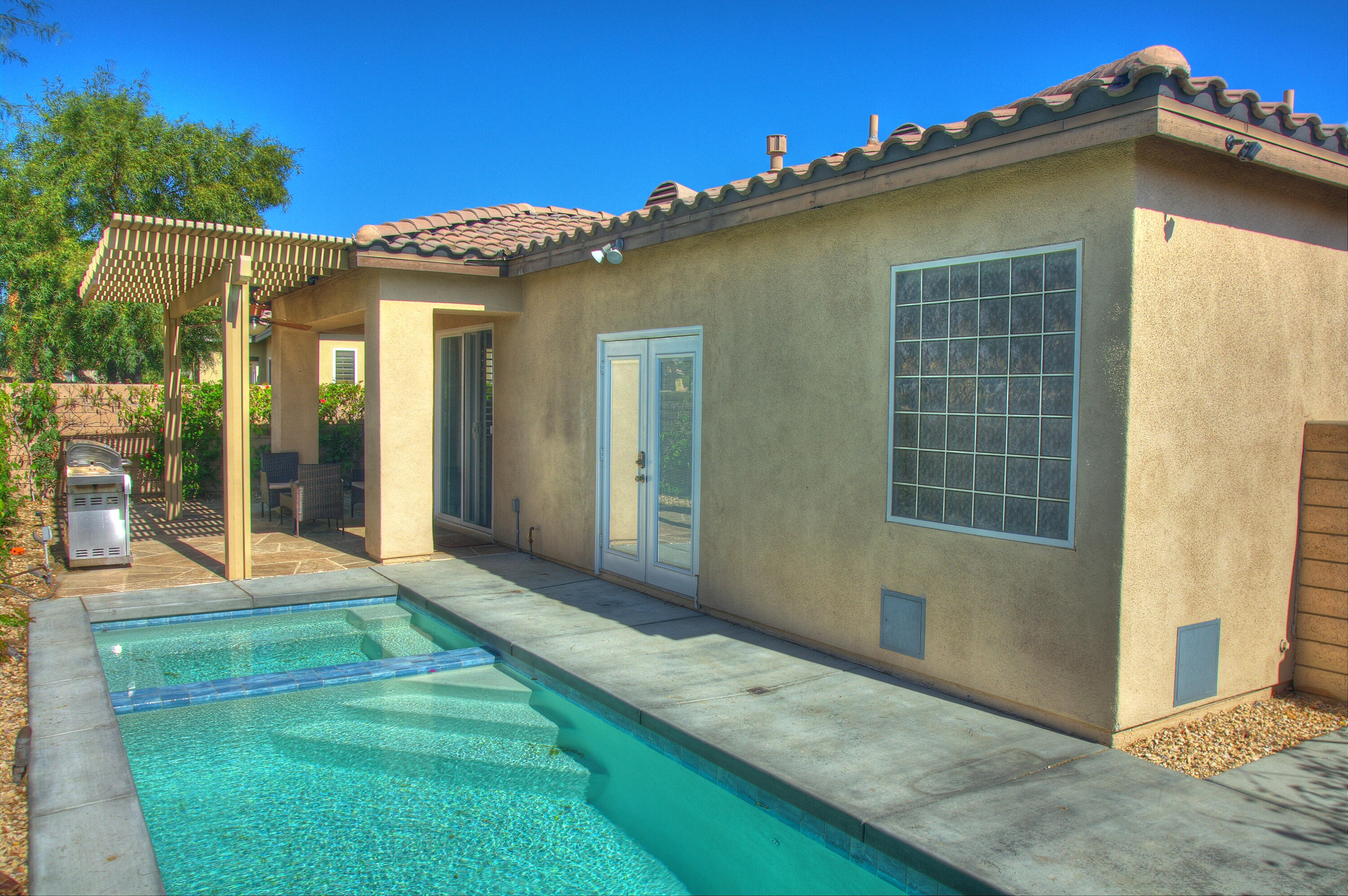 82053 Cochran Drive Indio, CA 92201 - Photo 36 of 38 a view of a house with backyard and porch