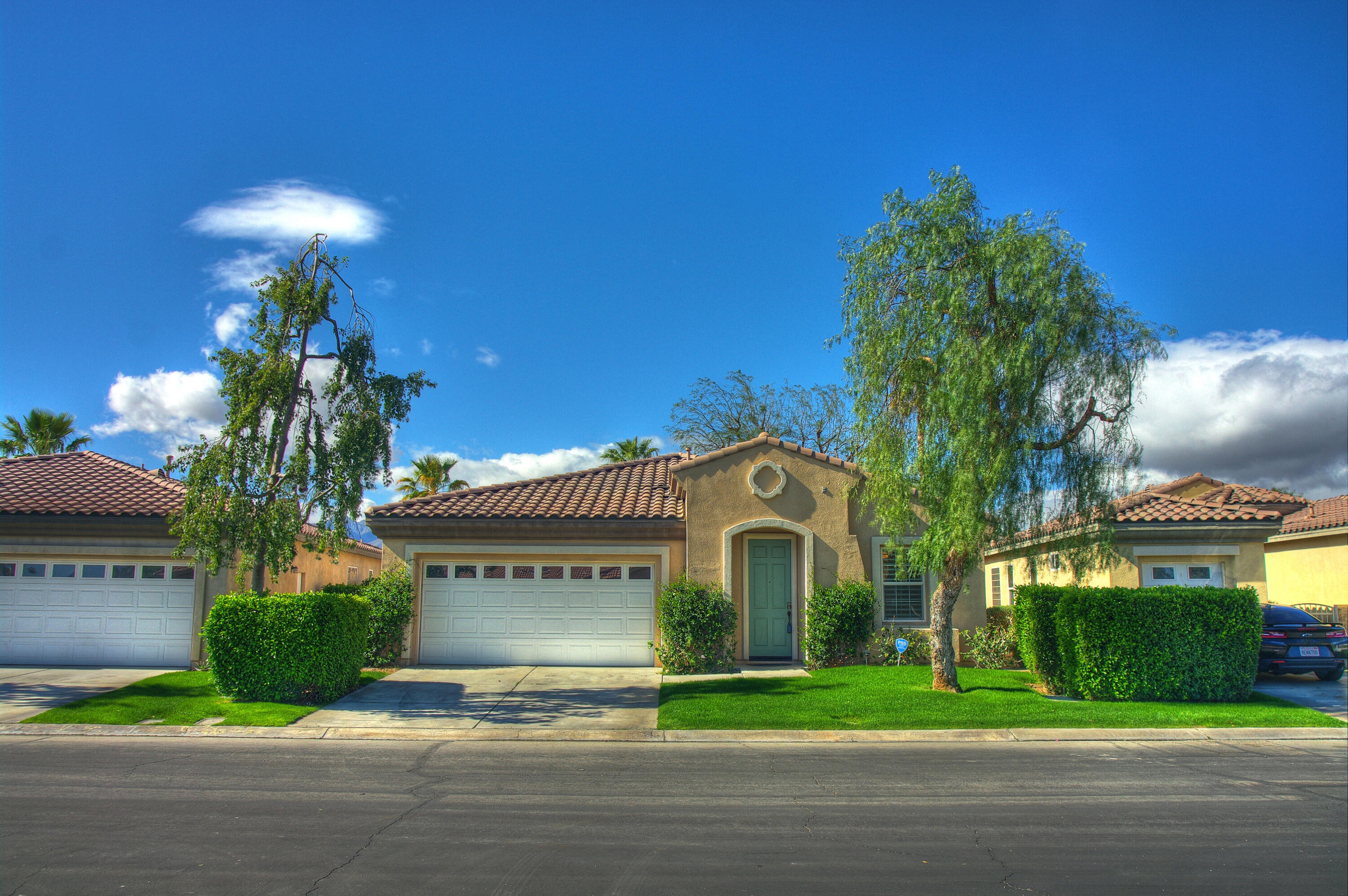 82053 Cochran Drive Indio, CA 92201 - Photo 38 of 38 a view of a house with a yard and a fountain