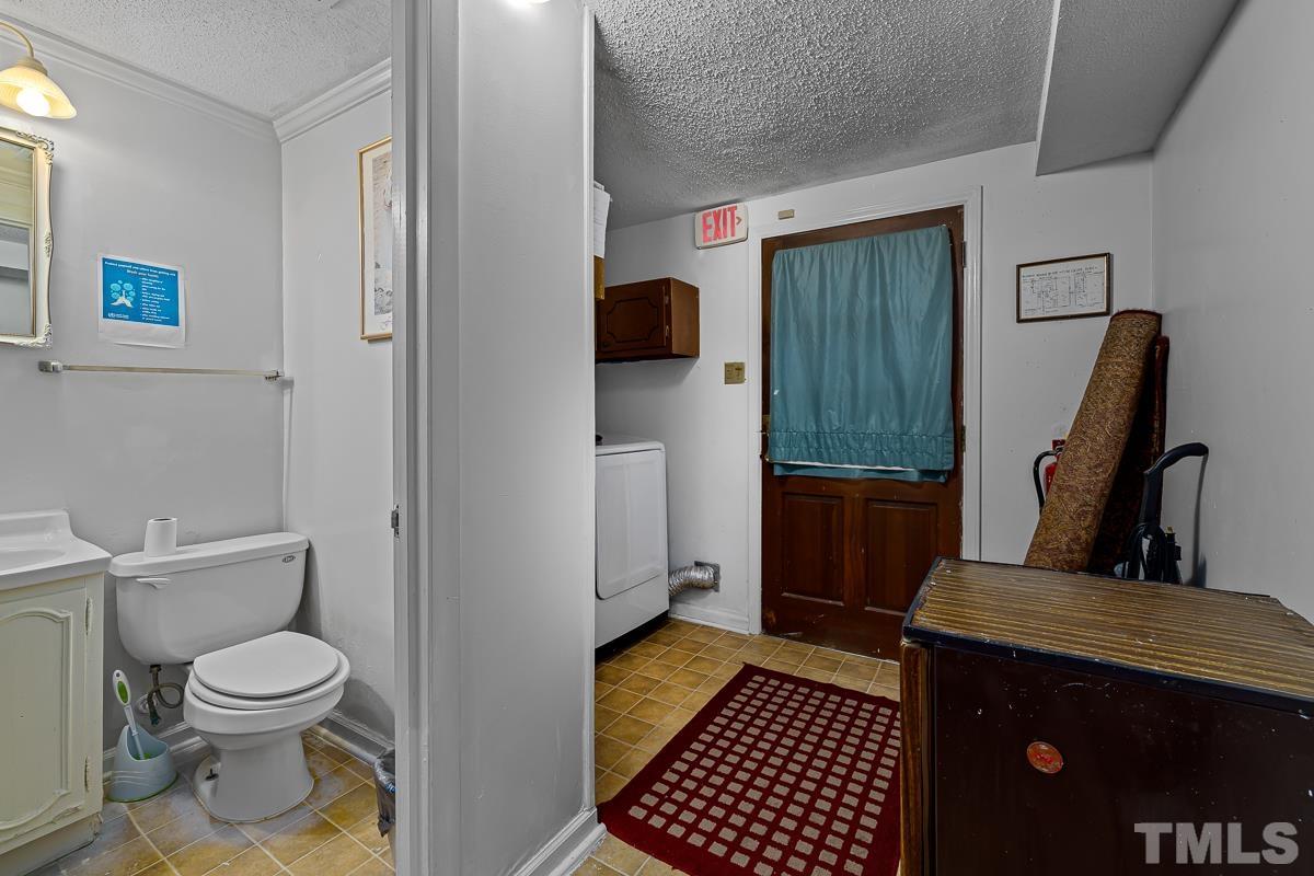 1120 Hardimont Road Raleigh, NC 27609 - Photo 13 of 24 a bathroom with a toilet and a shower