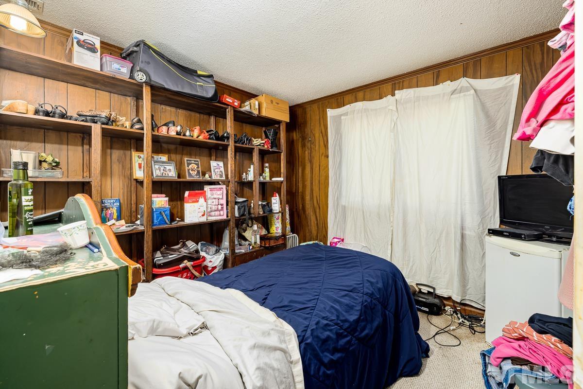 1120 Hardimont Road Raleigh, NC 27609 - Photo 17 of 24 a bedroom with a bed and a window