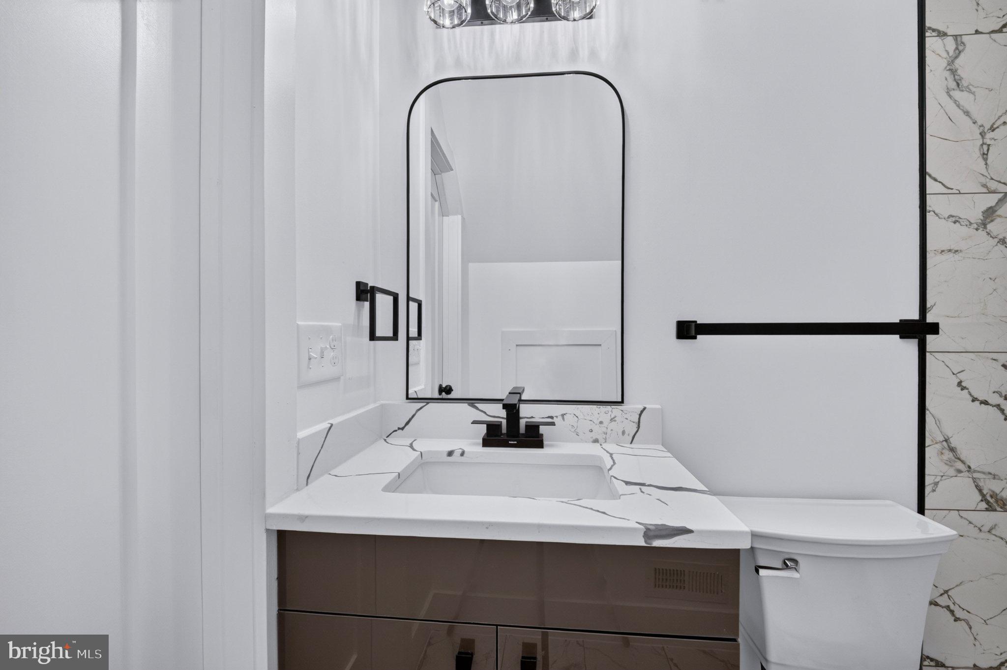 8323 Rolling Road Manassas, VA 20110 - Photo 64 of 97 Sleek modern bathroom with elegant finishes.