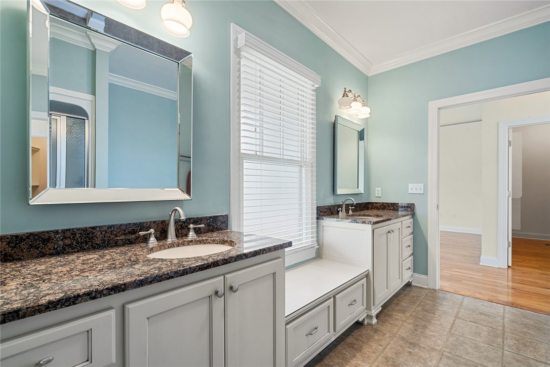 16 Oleander Drive Anderson, SC 29621 - Photo 26 of 37 Granite counters and dual vanities elevate this bathroom's design.