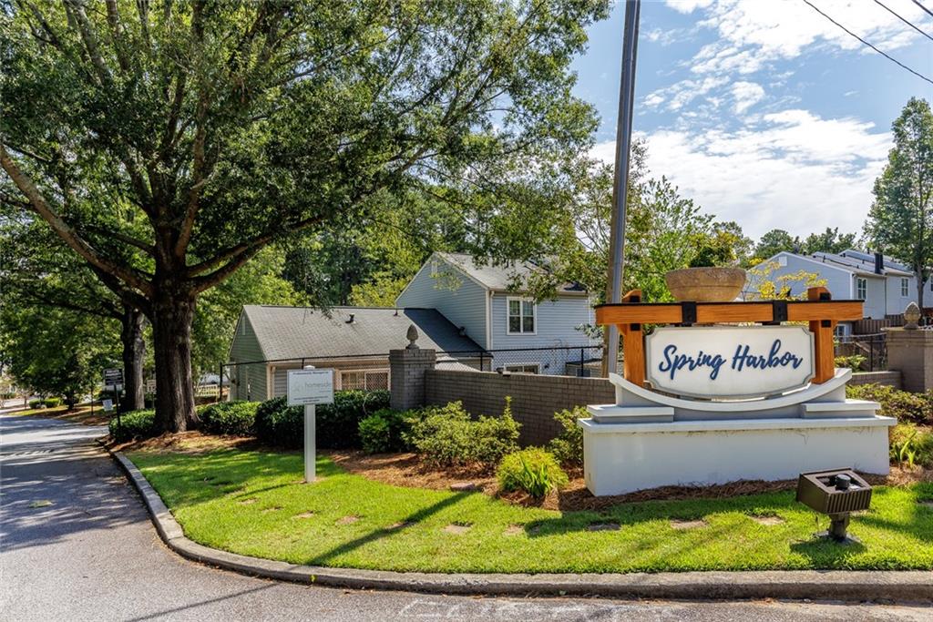 3403 Spring Harbor Lane Doraville, GA 30340 - Photo 1 of 1 a sign that is sitting on a brick road