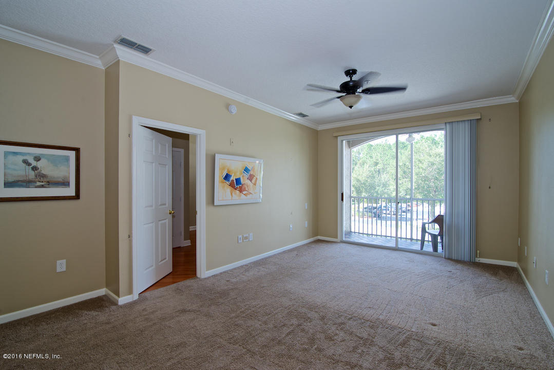 10550 Baymeadows Road, Unit 921 Jacksonville, FL 32256 - Photo 7 of 22 Living Room with Crown Molding