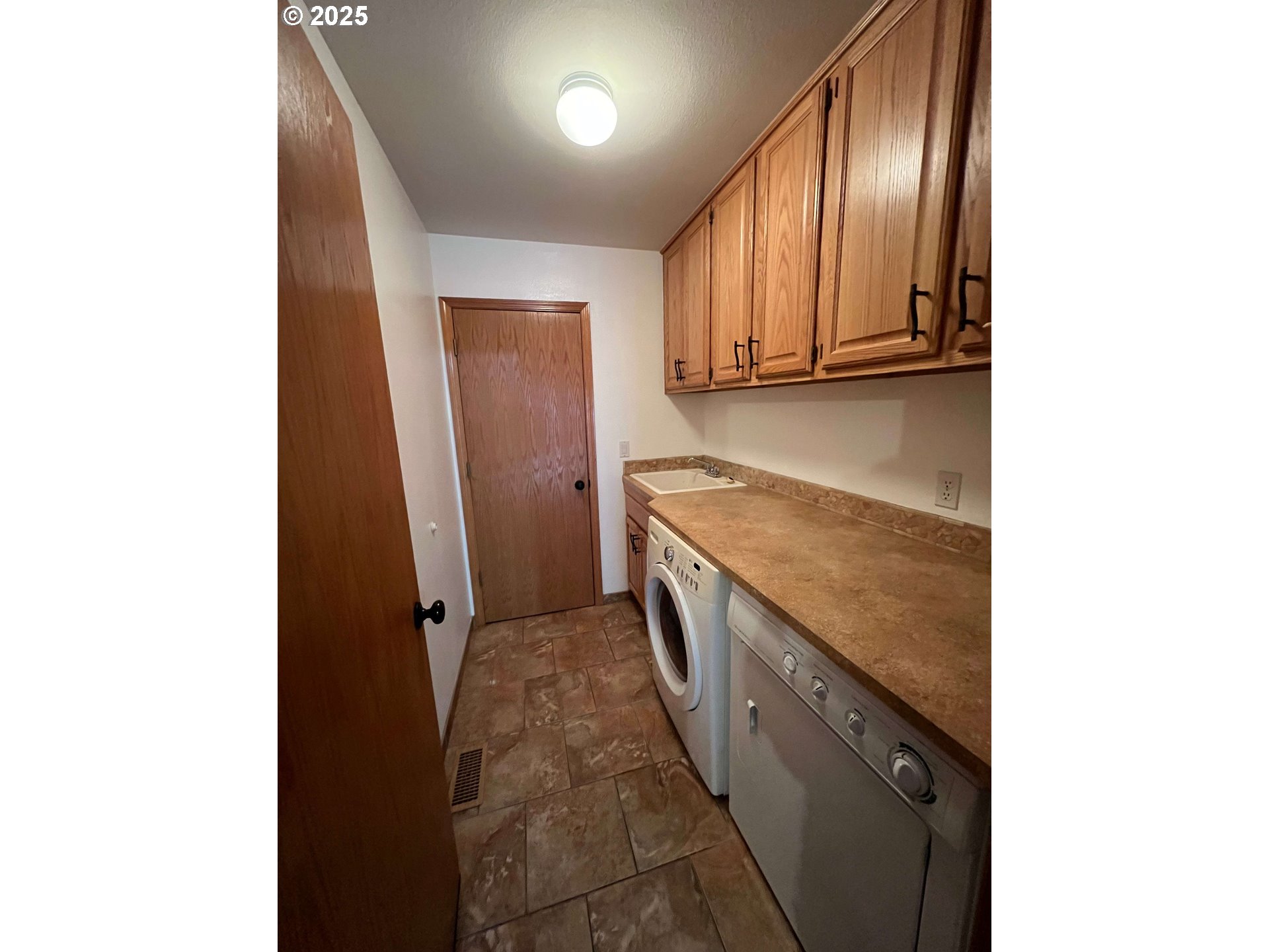 10340 Southwest Shearwater Loop Beaverton, OR 97007 - Photo 33 of 48 Laundry